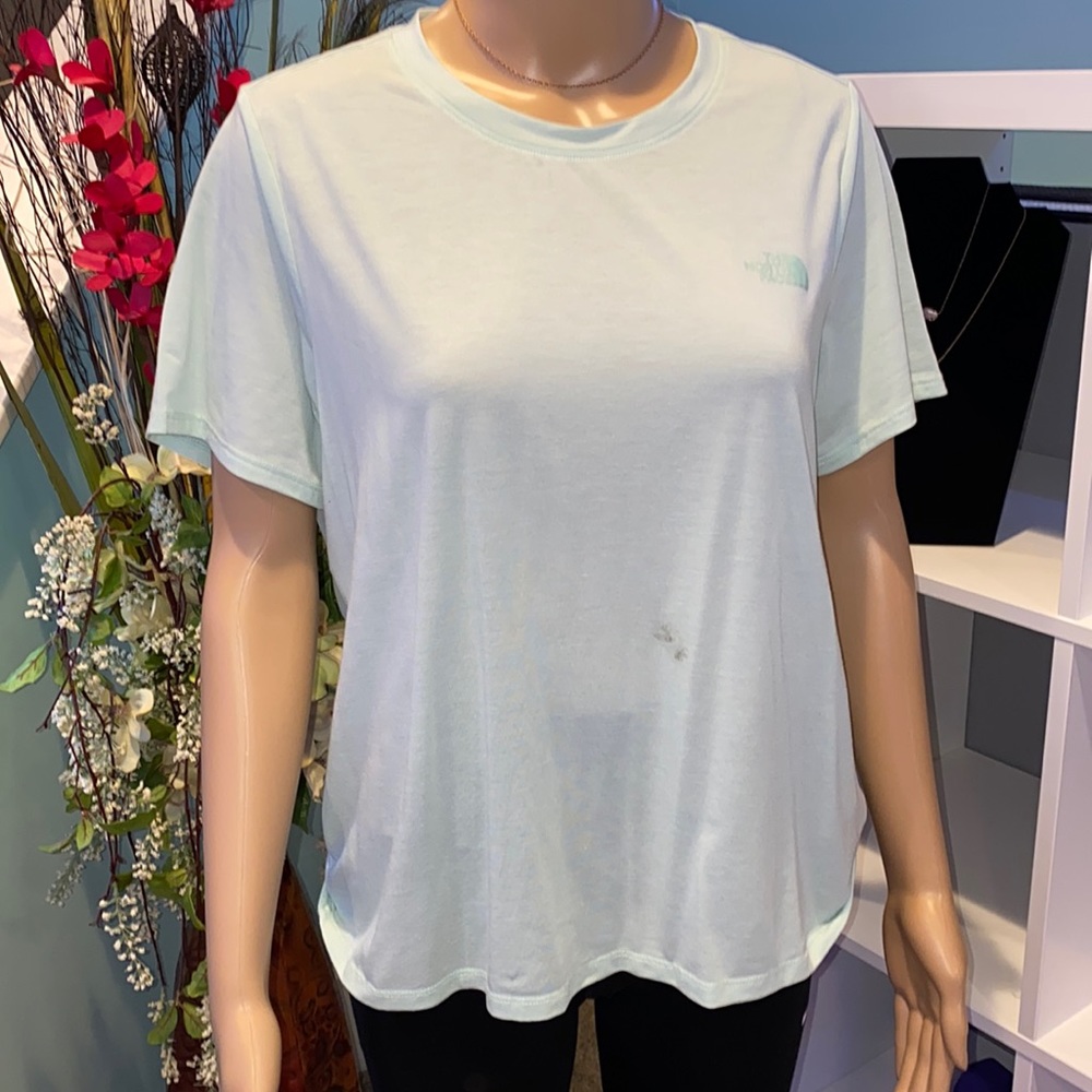 The North Face athletic mint green tee with crossover design on back.